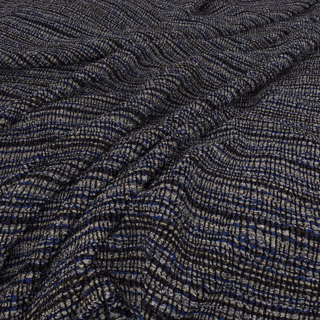 Ink-blue and charcoal rippled weave with pale flecks and crinkled texture