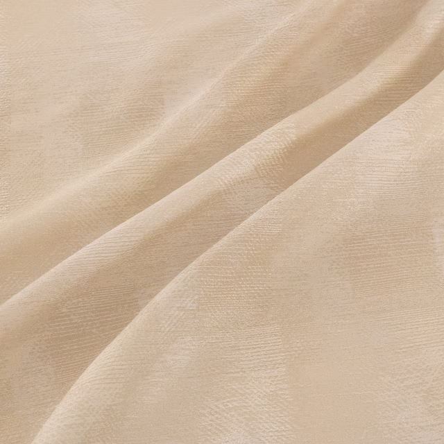 Warm sandstone beige fabric with fine tonal striations gathered into soft flowing folds