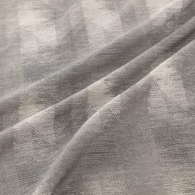 Cool steel-grey woven surface with painterly tonal bands and fine horizontal striations