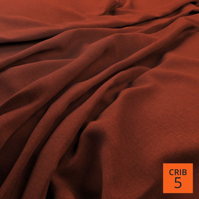 Burnt terracotta woven fabric draped in soft folds with a fine surface texture