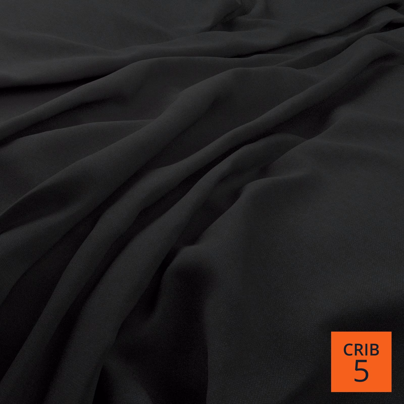 Near-black denim-blue cloth with a smooth matte surface gathered into fluid folds