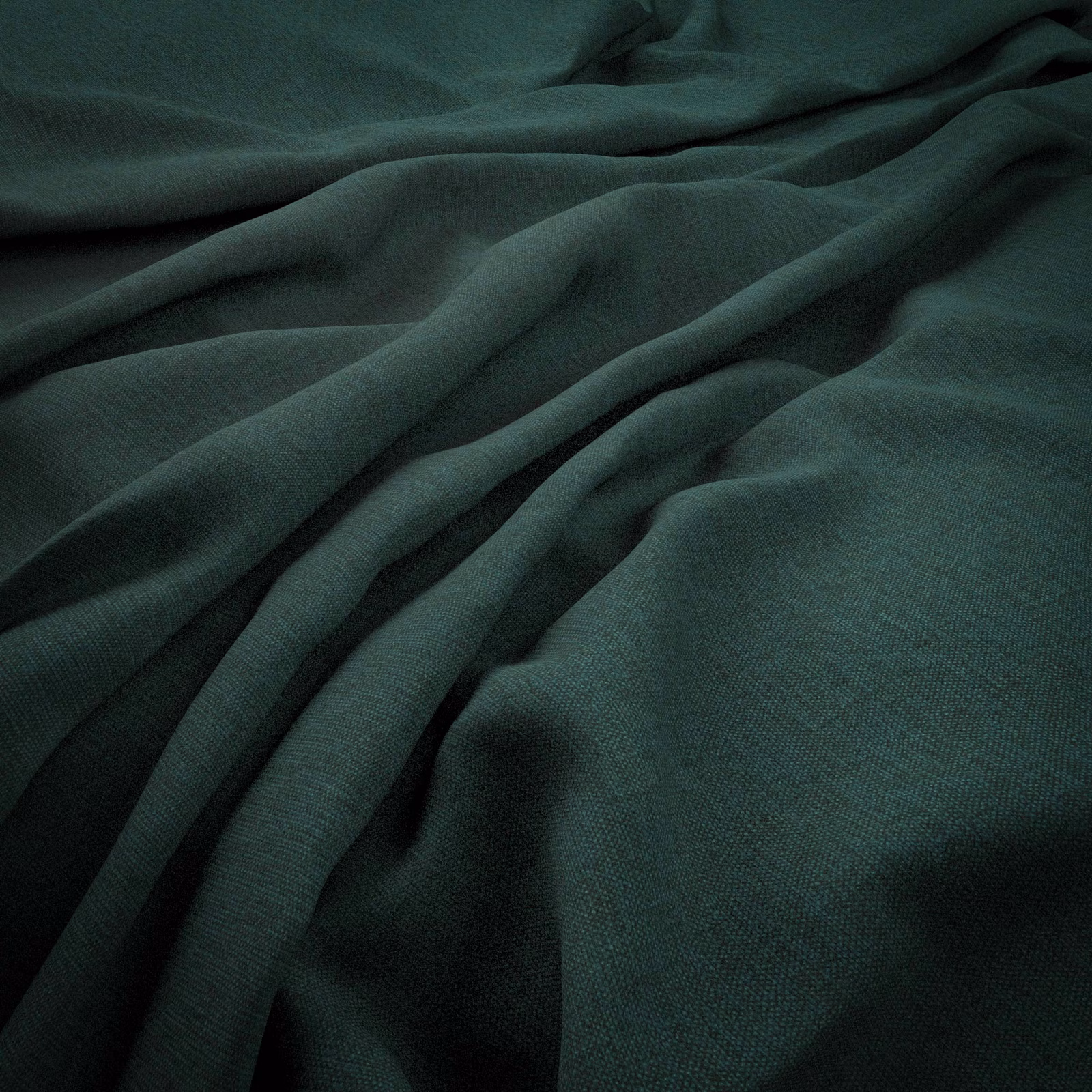 Deep mallard-green woven cloth gathered into softly shadowed, fluid folds