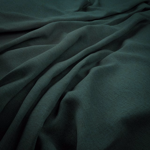 Deep mallard-green woven cloth gathered into softly shadowed, fluid folds