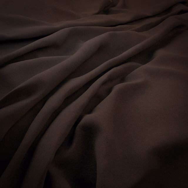 Deep port-brown cloth gathered into softly lustrous, flowing folds