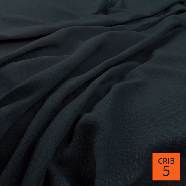 Near-black blue-green plain fabric falling in soft, fluid folds