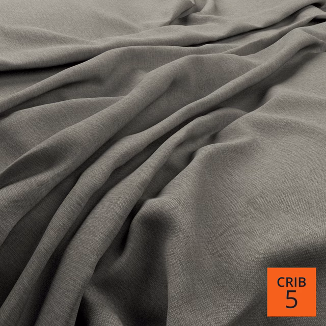 Cool graphite-grey woven fabric gathered into soft, shadowed folds