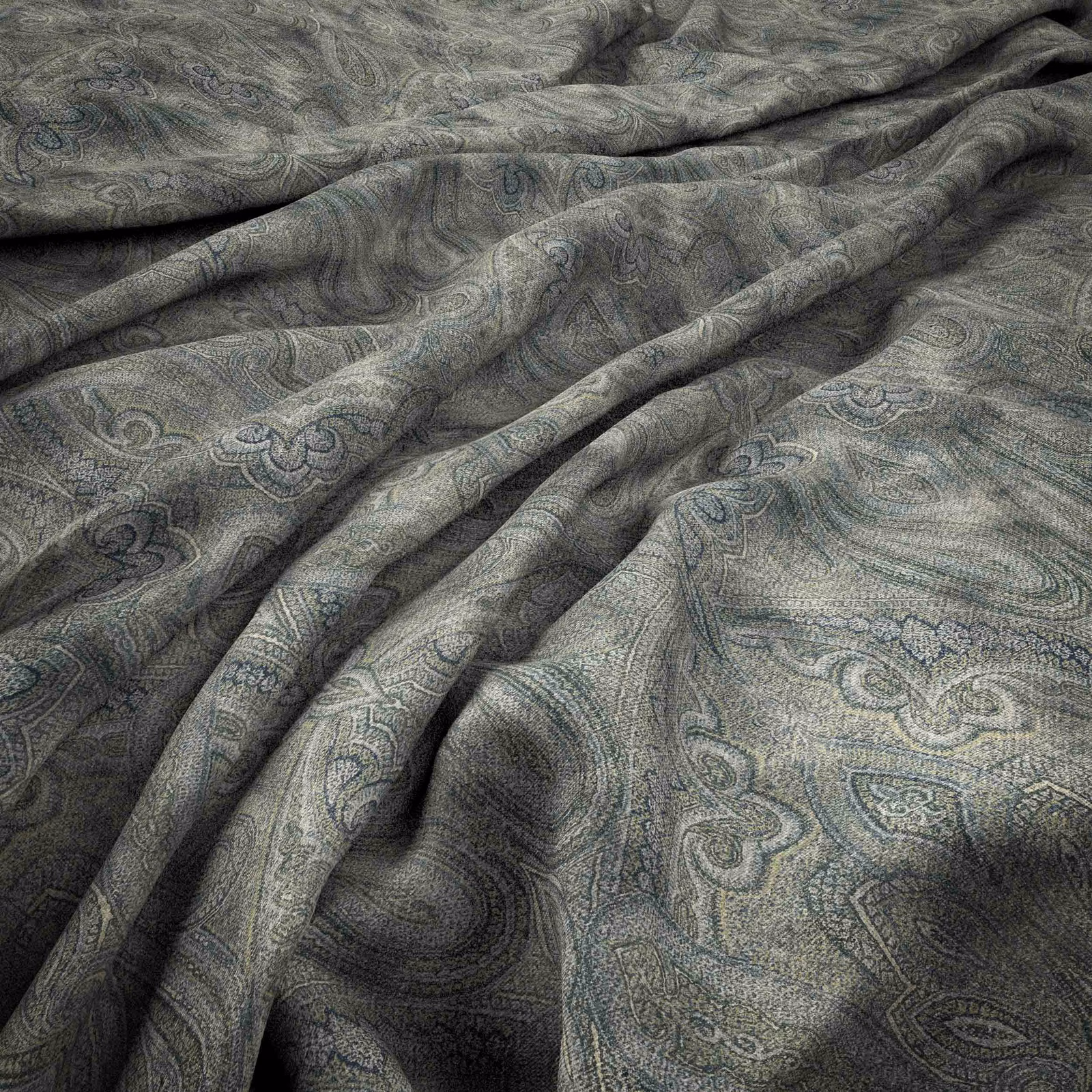 Charcoal-grey paisley textile with blue-green tracery and softly rippled woven texture
