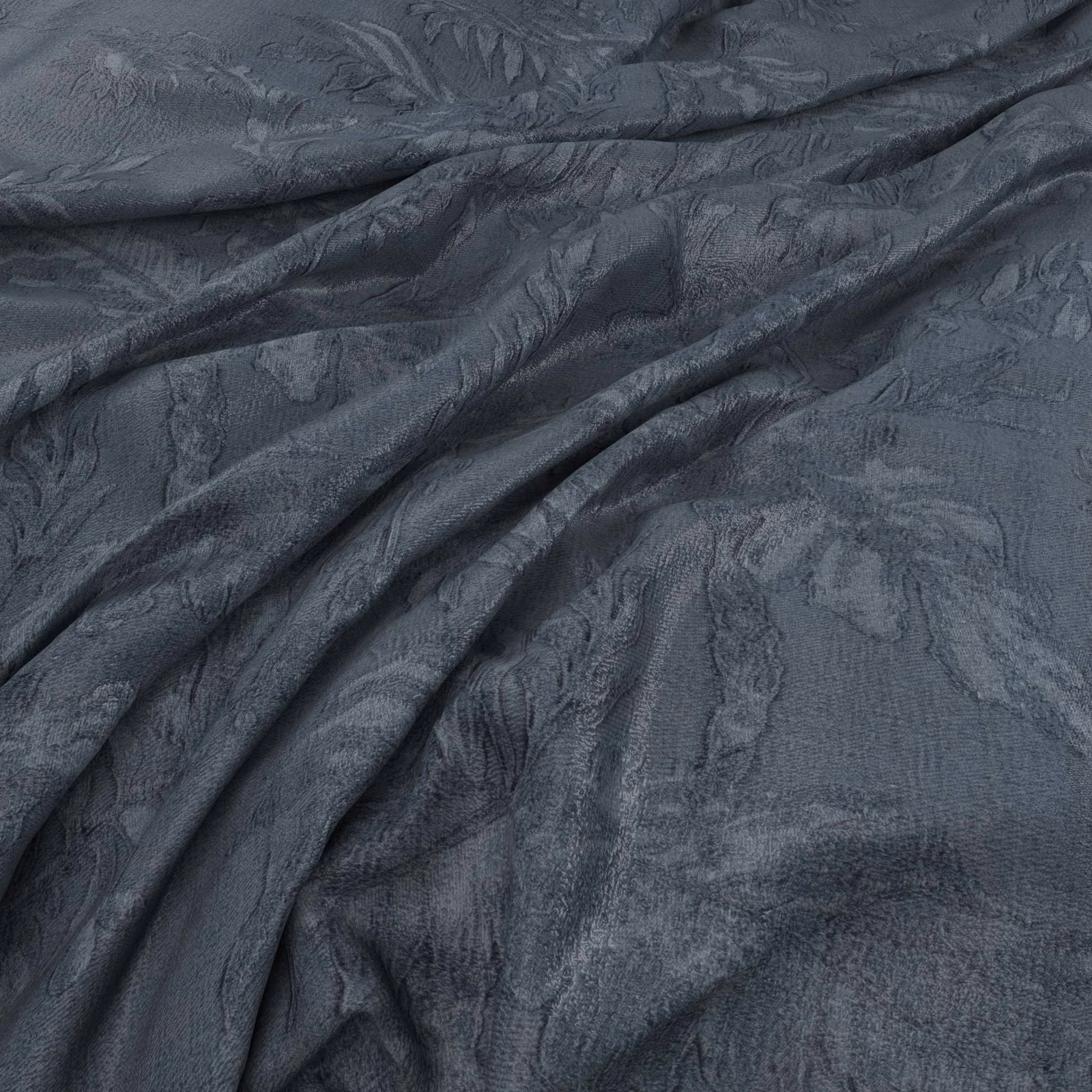 Deep denim blue-grey fabric with tonal leafy motifs and softly textured draped folds
