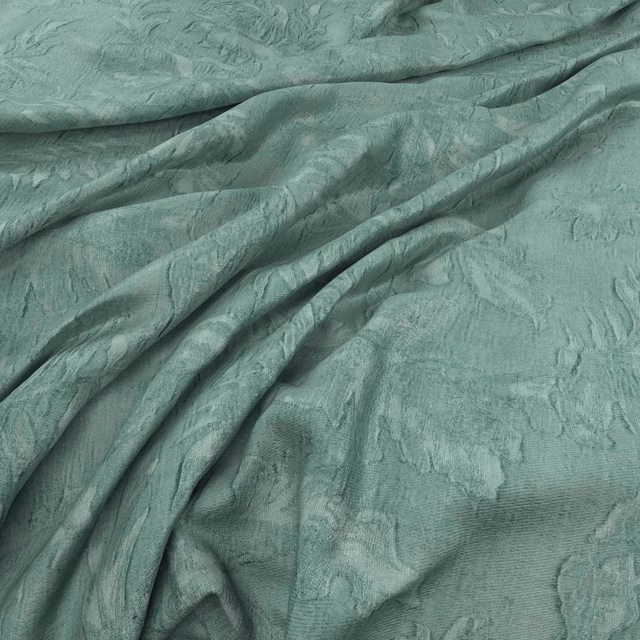 Draped Samani Seaglass fabric in muted sea-green with tonal organic relief