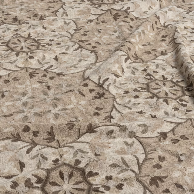 Warm taupe floral fabric with brown vines, pale blossoms and woven texture