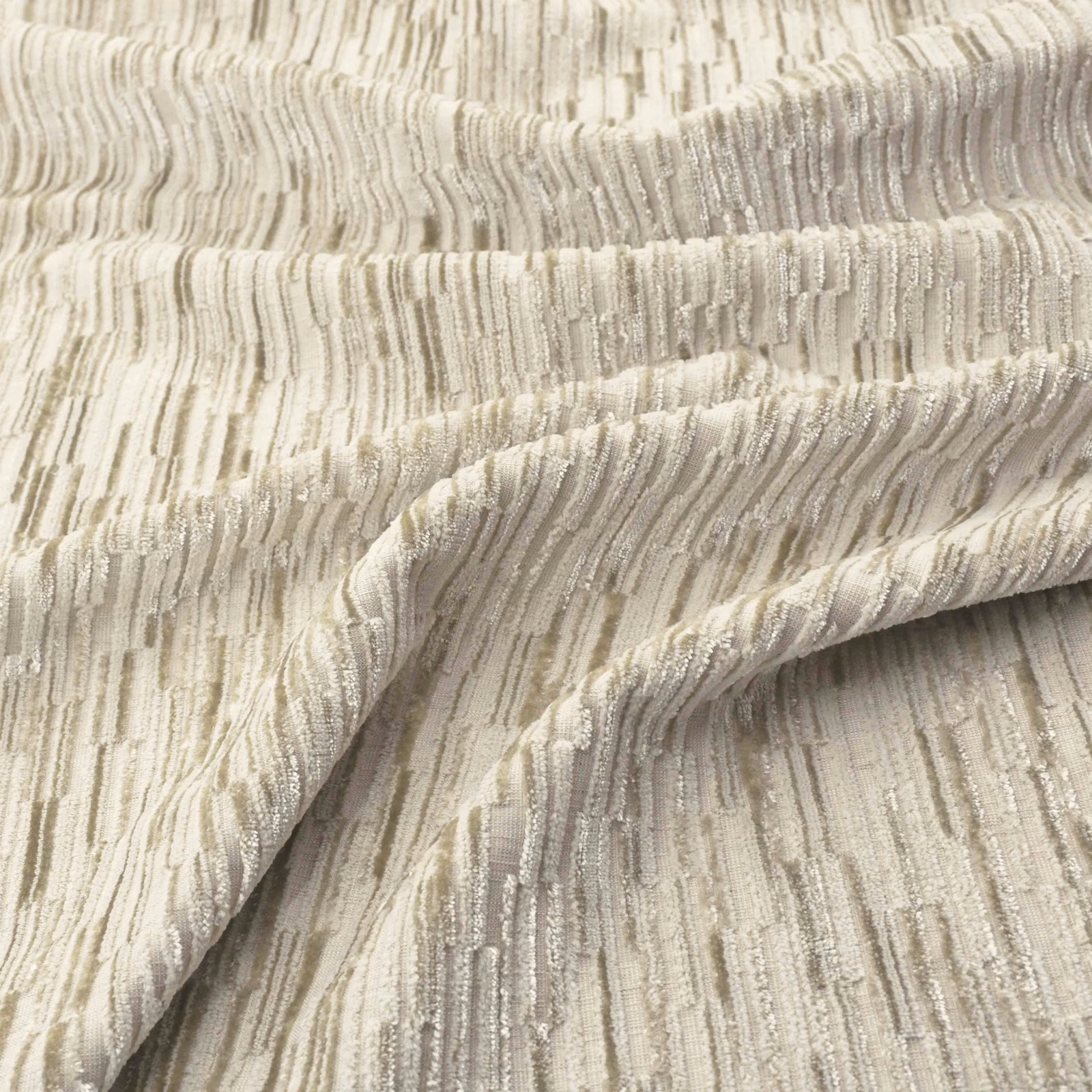 Warm sandstone beige woven fabric with irregular vertical striations and softly folded texture