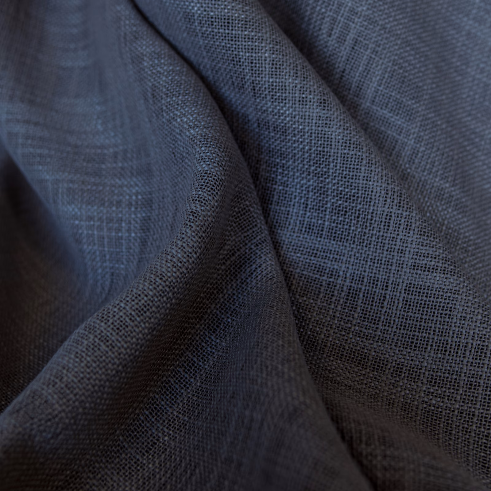 Cool charcoal blue-grey fabric with open checked weave gathered into deep soft folds