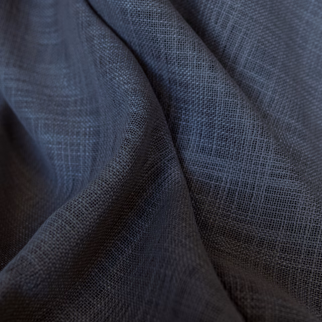 Cool charcoal blue-grey fabric with open checked weave gathered into deep soft folds