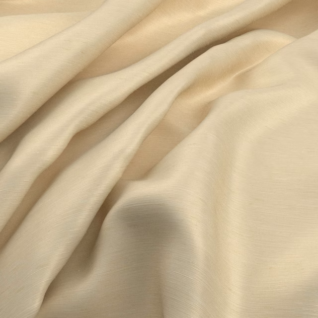 Warm almond cream fabric with fine woven lines falling into soft, fluid folds
