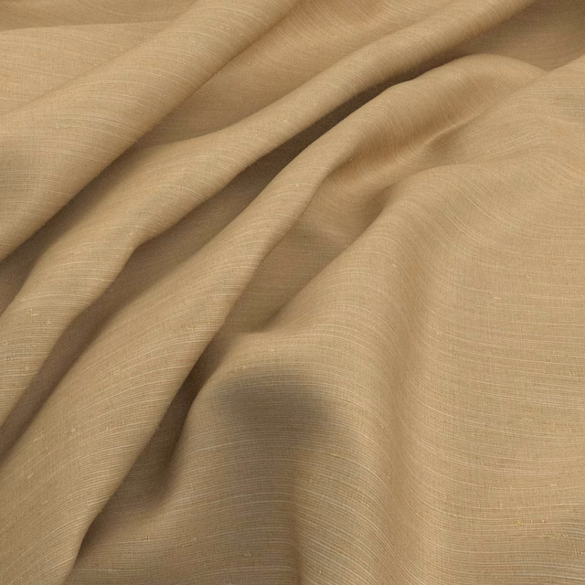 Warm champagne beige woven fabric with fine horizontal texture in soft flowing folds