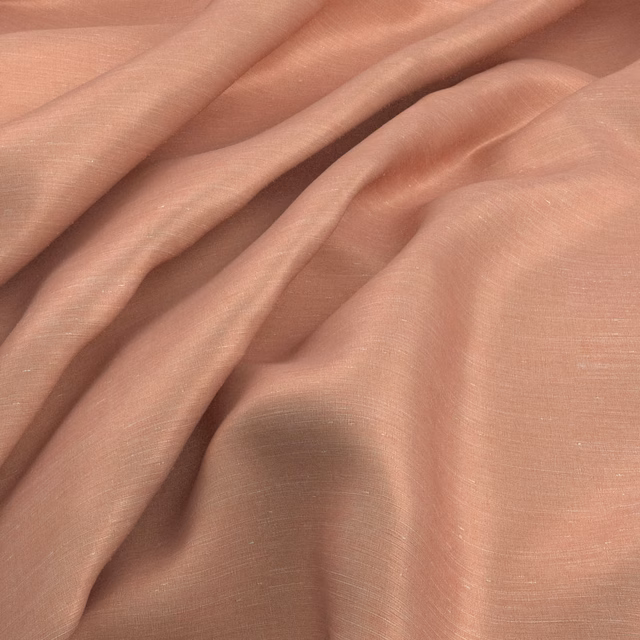 Muted blush-pink fabric with fine woven lines arranged in soft flowing folds