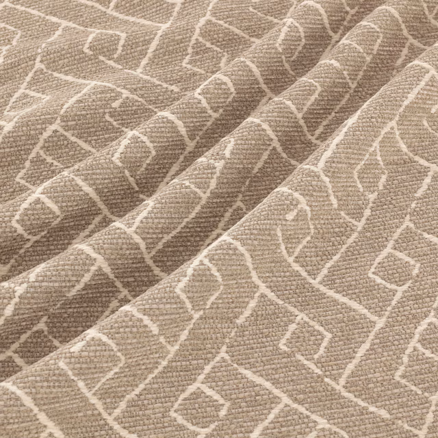 Warm taupe woven fabric with ivory angular geometric lines and softly nubby texture