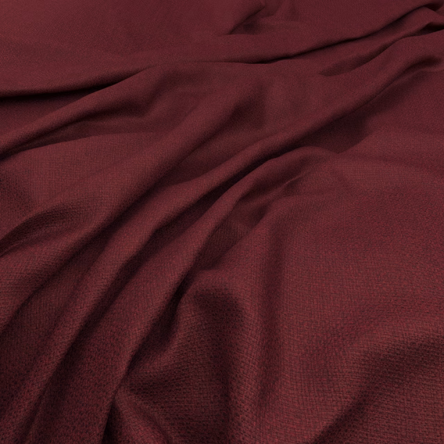 Deep merlot fabric with fine woven grain and fluid, shadowed folds