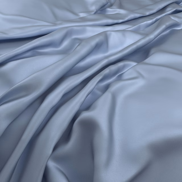 Cool airforce-blue smooth fabric draped in softly reflective flowing folds