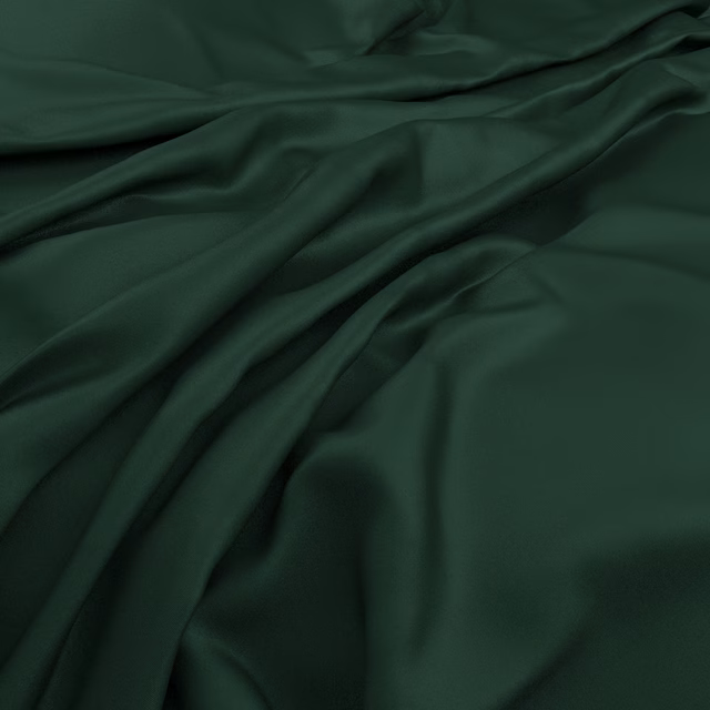 Deep bottle-green plain fabric gathered into fluid folds with a soft sheen