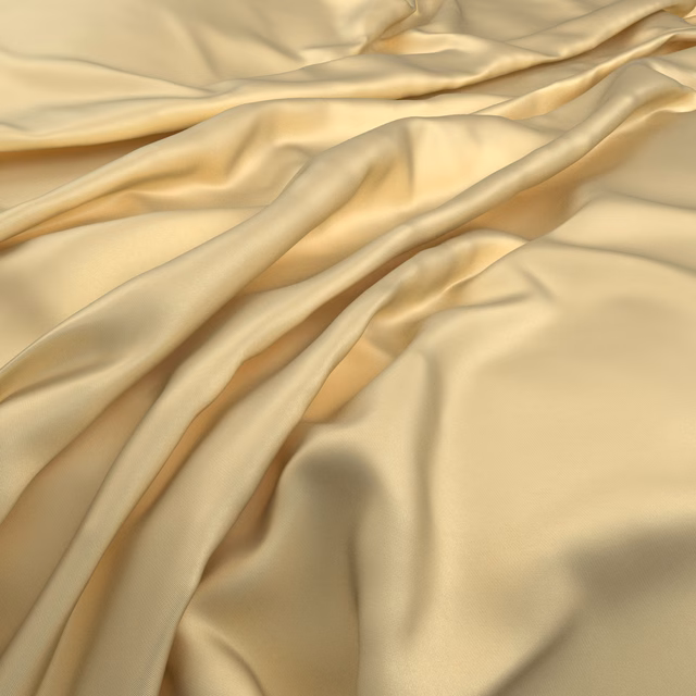 Warm butter-yellow fabric in fluid folds, with soft satin-like highlights
