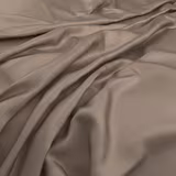 Warm chestnut-taupe fabric draped in soft folds with a subtle satin sheen