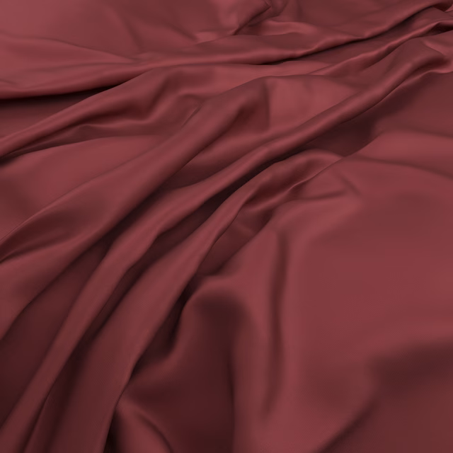 Deep crimson fabric with smooth sheen and flowing burgundy folds