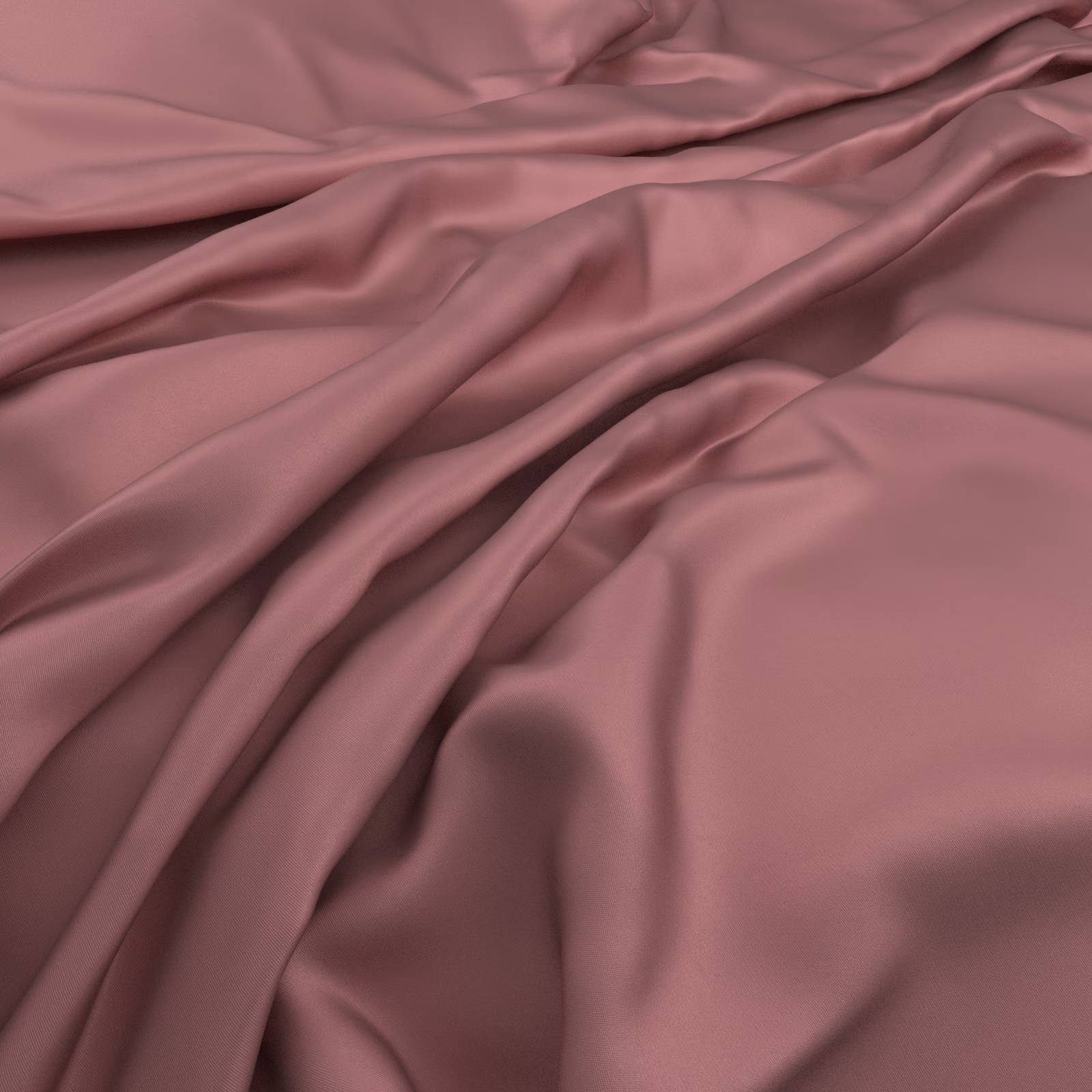 Close view of dusty rose fabric falling in softly lustrous, fluid folds