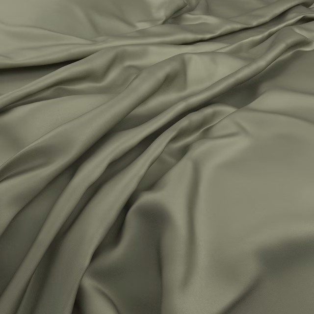 Fluid eucalyptus green fabric with smooth folds and softly reflective highlights