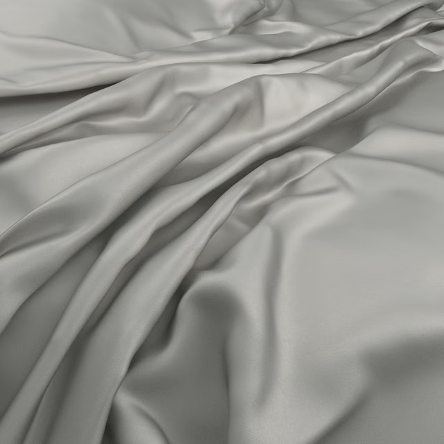 Pale frost-grey smooth fabric falling in softly lit, fluid folds
