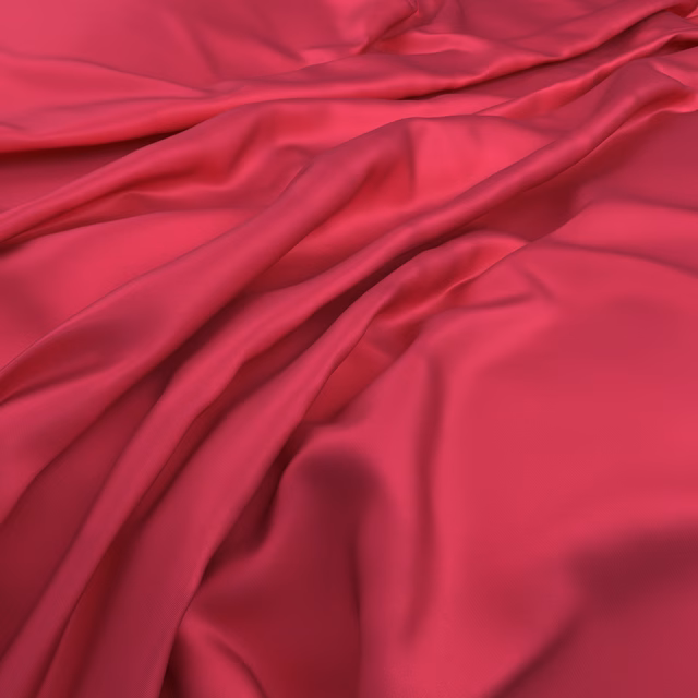 Saturated fuchsia pink fabric falling in glossy, fluid folds with deep raspberry shadows