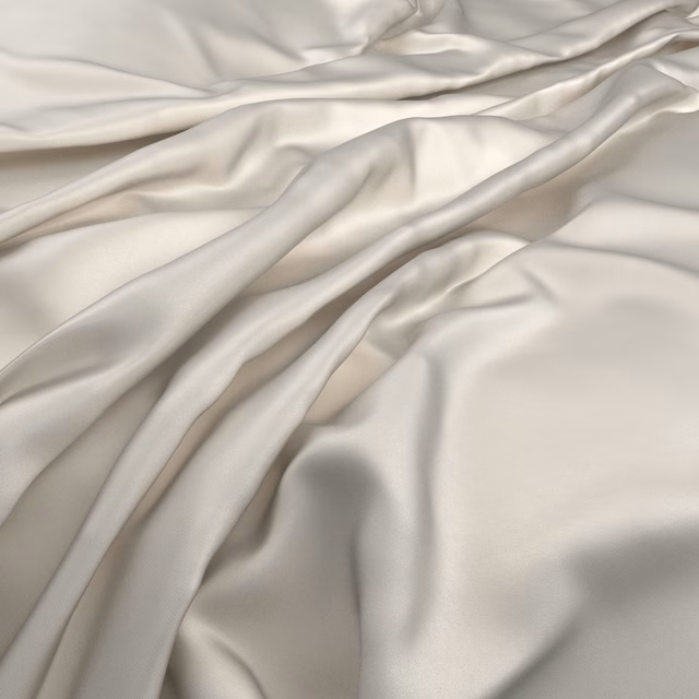 Pale ivory-grey Serena fabric gathered into softly gleaming, fluid folds
