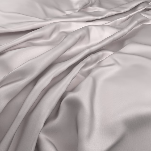 Pale Glacier grey cloth falling in smooth, lustrous folds with cool lilac shadows