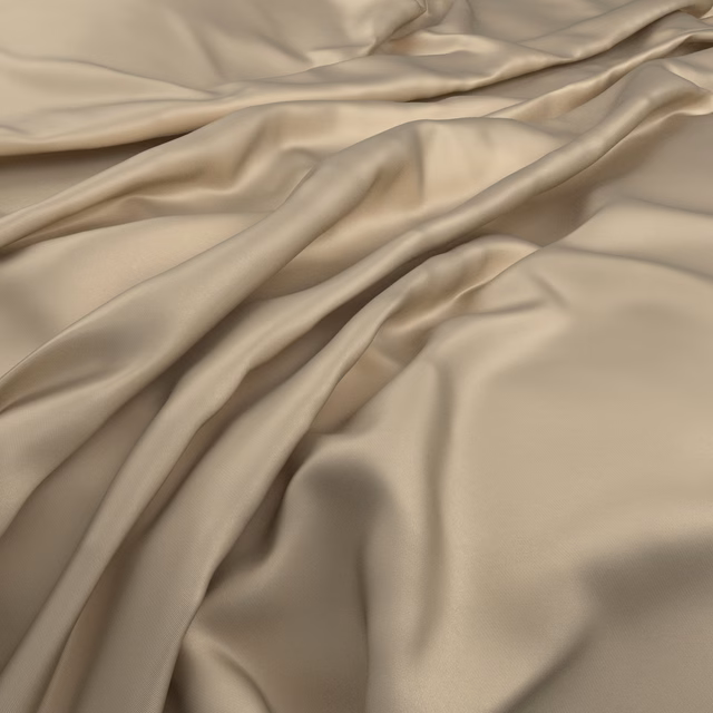 Warm honey-beige fabric draped in smooth folds with soft satin-like highlights