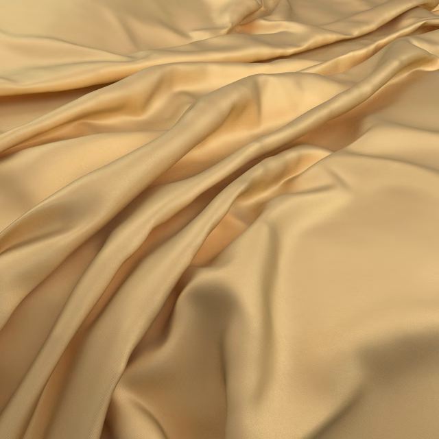 Warm marigold-gold fabric falling in smooth, softly reflective draped folds