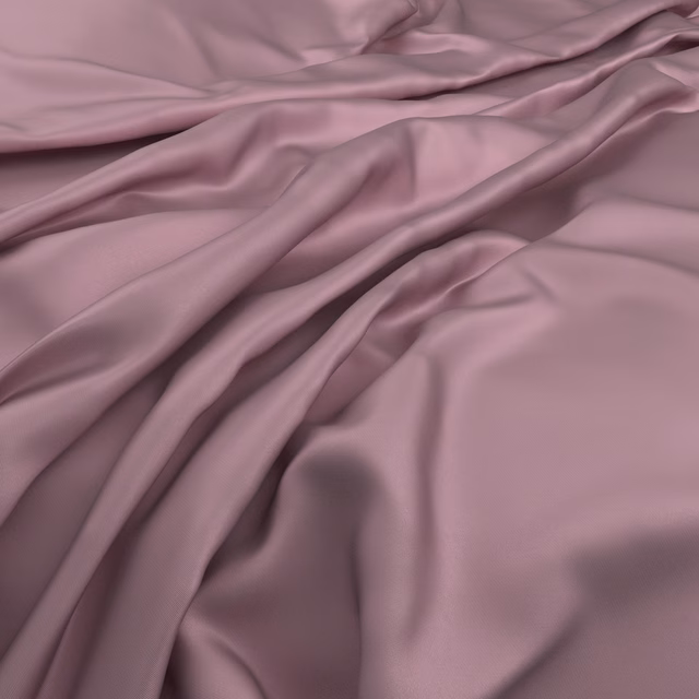 Fluid dusty mauve fabric with smooth sheen and deep flowing folds
