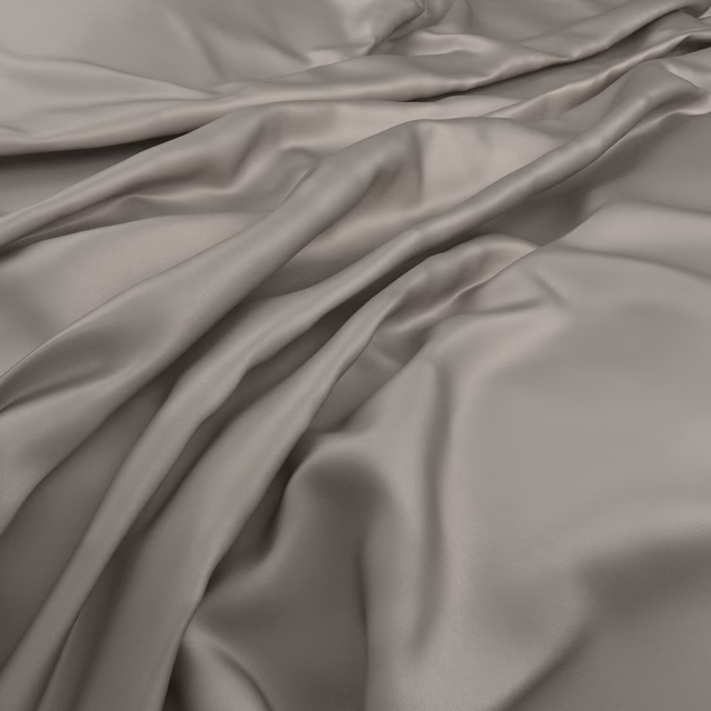 Fluid stone-grey fabric with satin sheen falling in soft sculptural folds