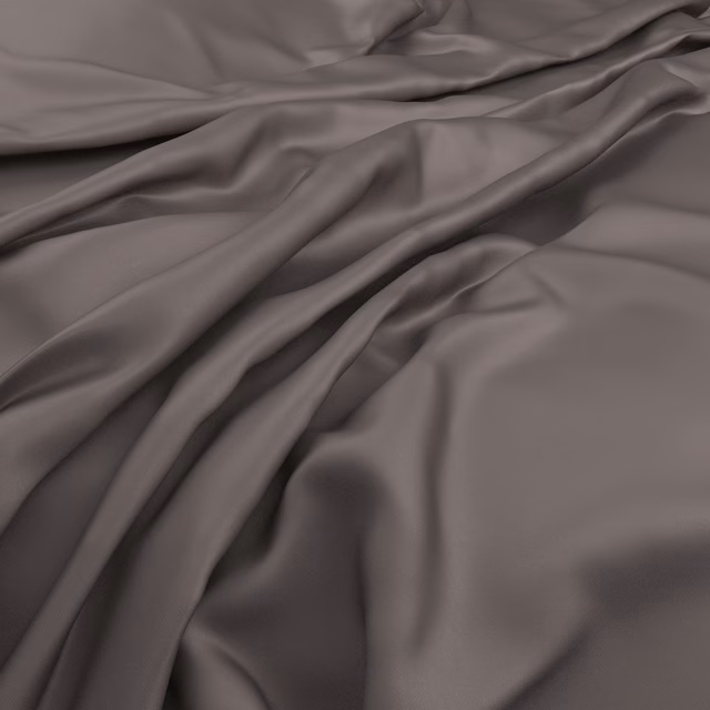 Fluid nickel-grey cloth gathered into soft, reflective folds