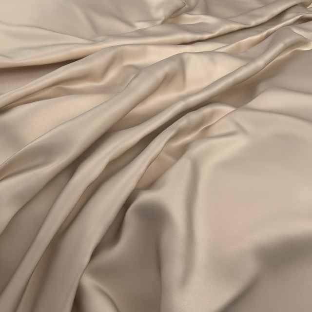Soft antique-gold fabric gathered in fluid folds with a subtle satin sheen