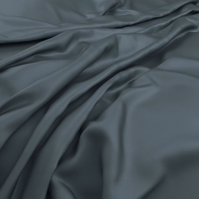 Cool slate-blue fabric falling in soft folds with a restrained satin sheen