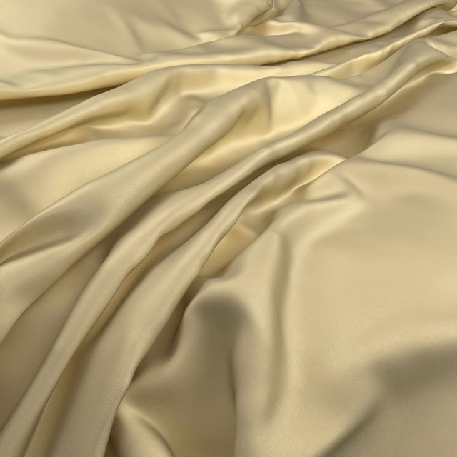 Pale pistachio-green fabric draped in smooth, lustrous folds with olive-gold shaded creases