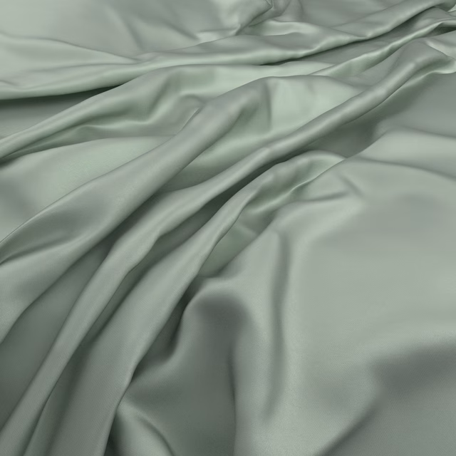 Muted rosemary-green smooth fabric draped in fluid, softly lustrous folds