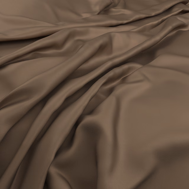 Warm saddle-brown fabric falling in smooth, softly lustrous gathered folds