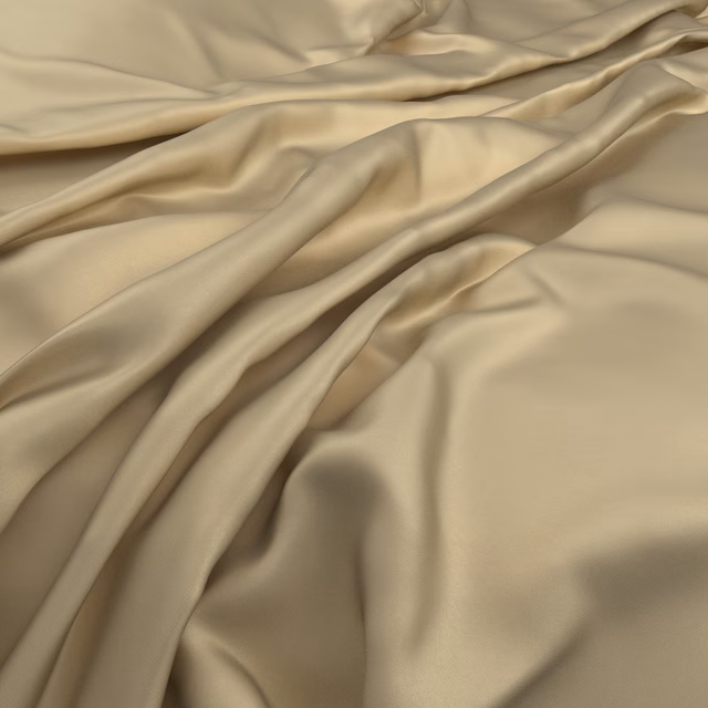 Warm champagne-beige satin-like fabric gathered into softly reflective flowing folds