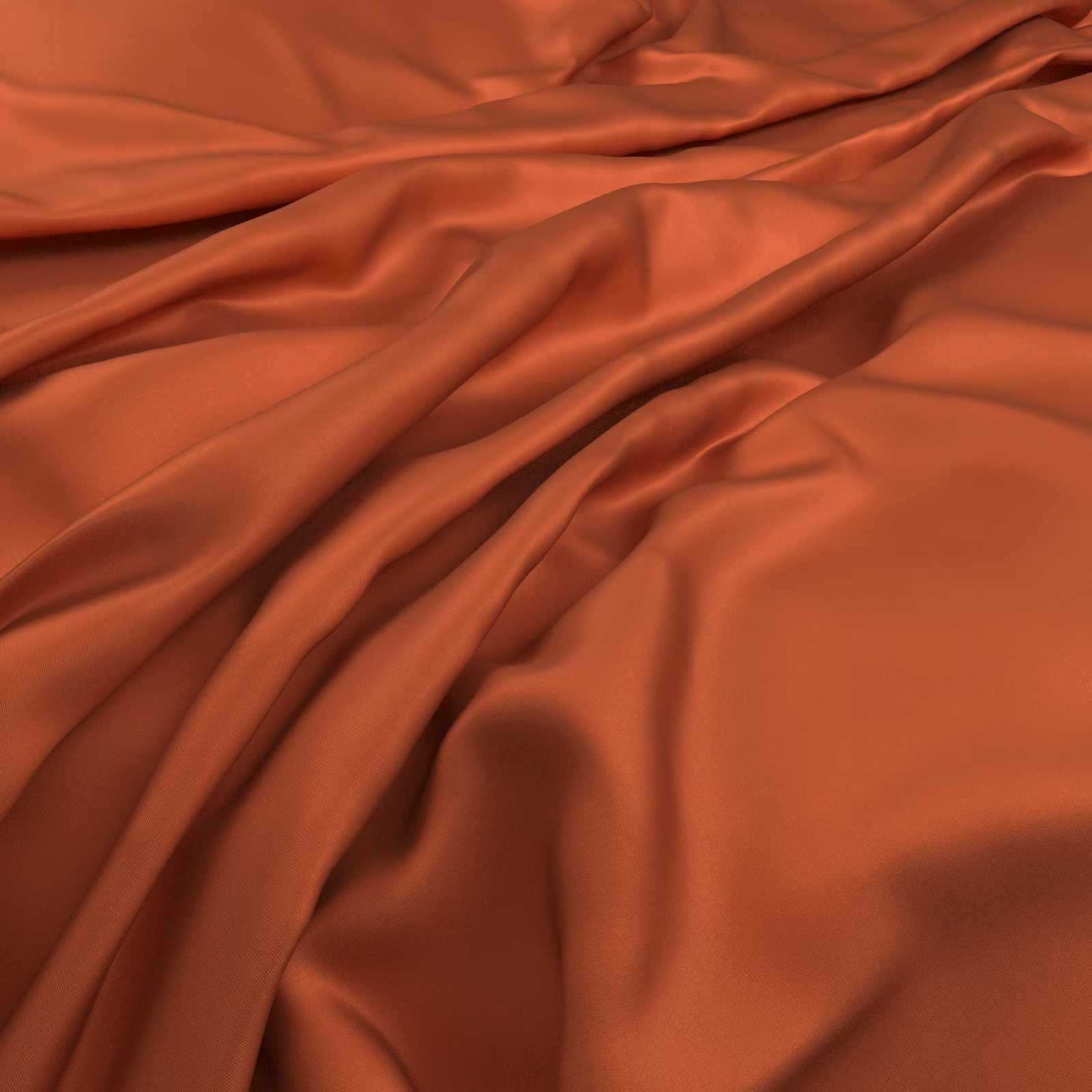 Warm tandoori terracotta fabric draped in folds with a smooth satin-like sheen