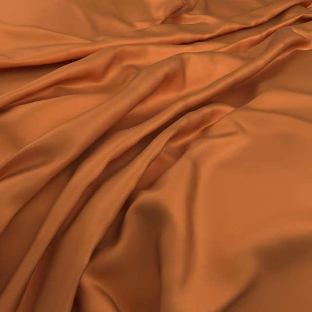 Warm tangerine-orange fabric with satin-like highlights in flowing gathered folds