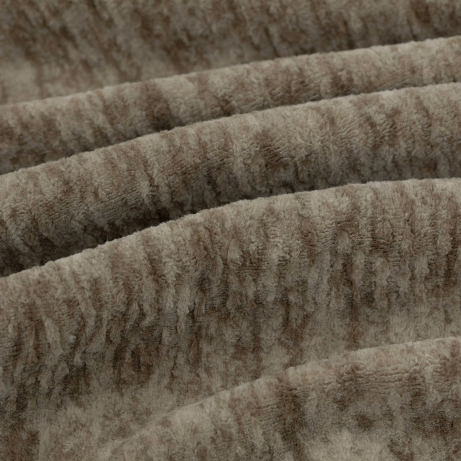 Warm bark-brown sherpa pile with irregular vertical ridges shown in folded swatch