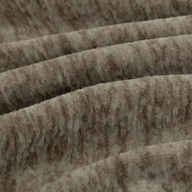 Warm bark-brown sherpa pile with irregular vertical ridges shown in folded swatch