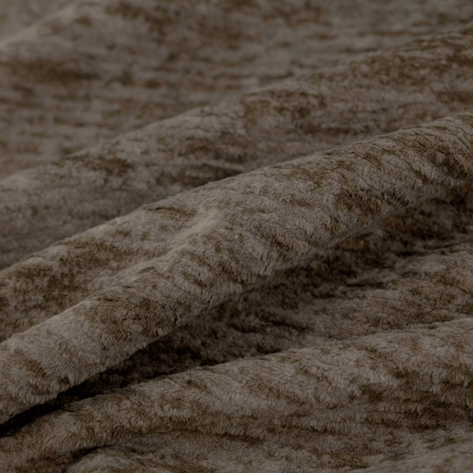 Warm chestnut-brown nubby pile shown in softly ridged fabric folds