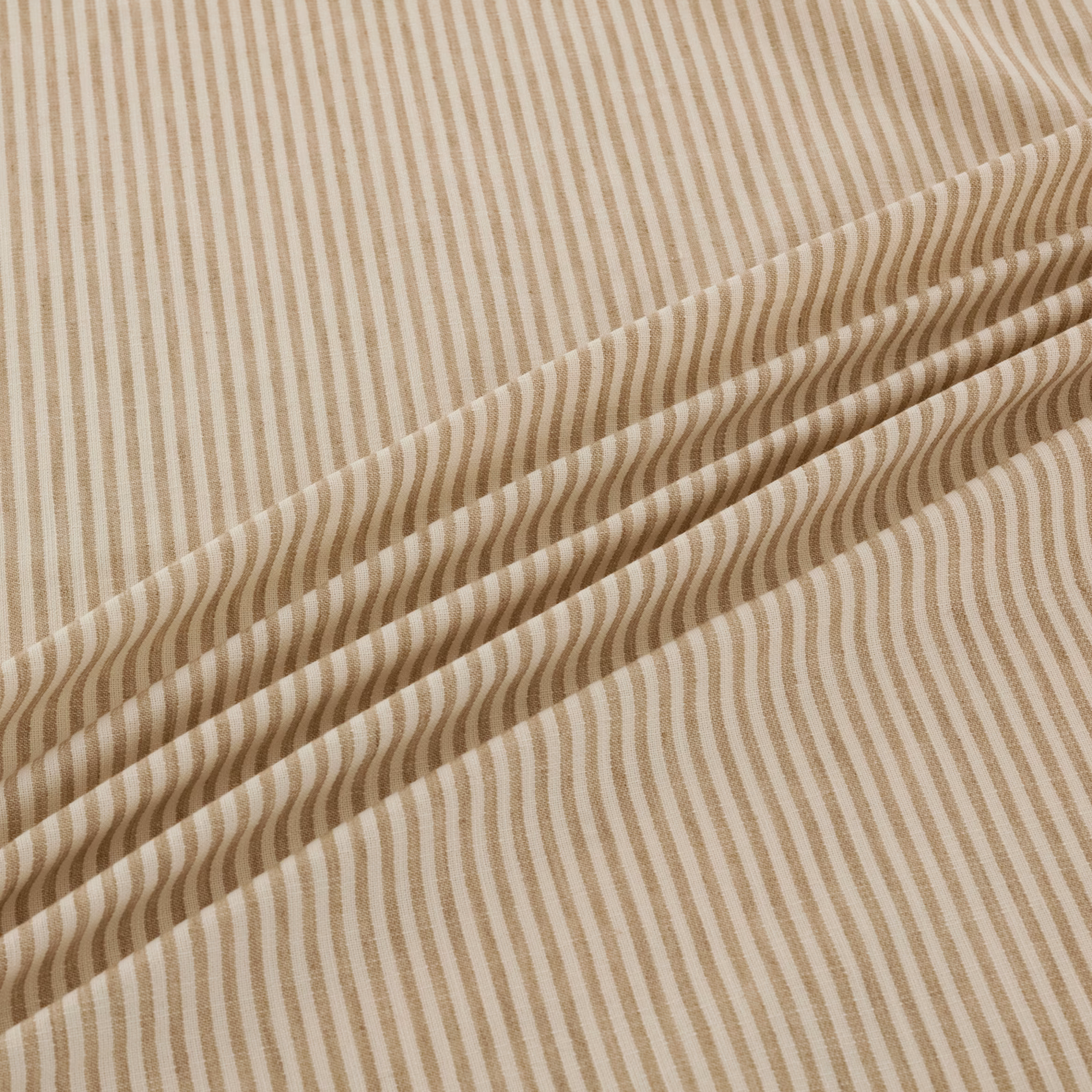 Warm papyrus-beige fabric with fine vertical stripes bending into waves across a fold